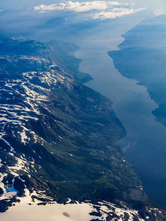 View from airplane to norwegian fjords landscape. Aircraft flying over Norway Scandinavia.の写真素材