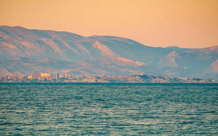 Mediterranean seascape, spanish Costa Blanca coastline in the evening light, Alicante coast in the distanceの写真素材
