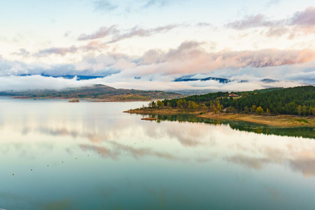 Morning landscape. Fog and clouds over lake Embalse de Aguilar de Campoo in province of Palencia, Castile and Leon community, northern Spain.の写真素材