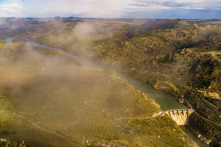 Mountain landscape and Douro river with spanish Saucelle Dam. Border between Portugal and Spain. National Park. View from portuguese Penedo Durao lookout.の写真素材