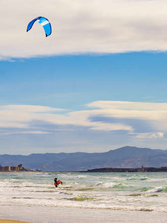 Kiteboarding. kite surfer rides the waves. Sports activity. Kitesurfing action.の写真素材