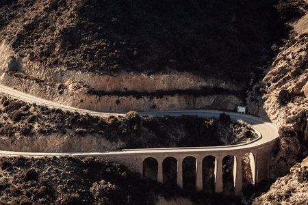 View from Granatilla Carboneras Viewpoint of hilly landscape, curved road and large viaduct. Cabo de...