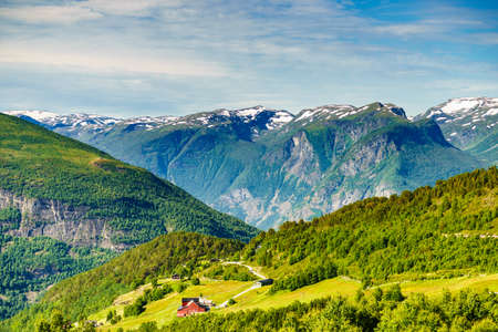 Norwegian country houses in mountains, farm village. Scenic summer landscape in Norway, Scandinaviaの写真素材