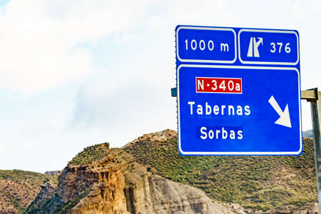 Road sign of Tabernas and desert landscape, province of Almeria Spain. Movie location set for spaghetti western. Travel destination.の写真素材