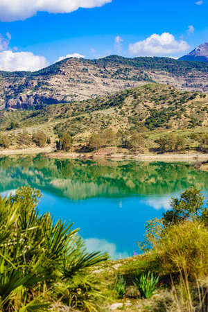 Spanish nature landscape. Lake Embalse del Guadalhorce and surrounding countryside, Ardales Reservoir, Malaga Andalusia, Spainの写真素材