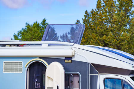 Sunroof, raisable panel window on roof top of rv camper vehicle. Traveling by motorhome.の写真素材