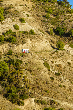 Caravan on spanish coast, seaside cliffs of Maro Cerro Gordo. Costa del Sol, Andalusia Spain. Vacation with motor homeの写真素材