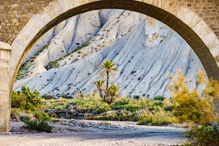 Arch bridge and Tabernas desert landscape. Province Almeria, Andalusia Spain. Natural area. Interesting place to visit. Tourist attraction.