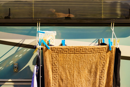 Wild camping on nature. Camper car rv with clothes hanging to dry. Holidays with motor home.の写真素材