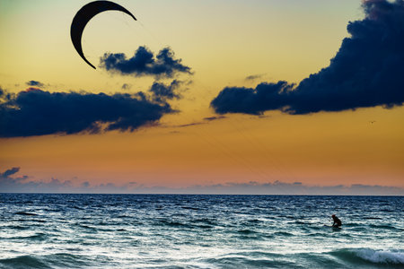 kiteboarding. kite surfer rides the waves. sports activities. Kitesurf action.の写真素材