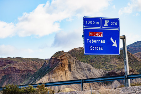 Road sign of Tabernas and desert landscape, province of Almeria Spain. Movie location set for spaghetti western. travel destination.の写真素材