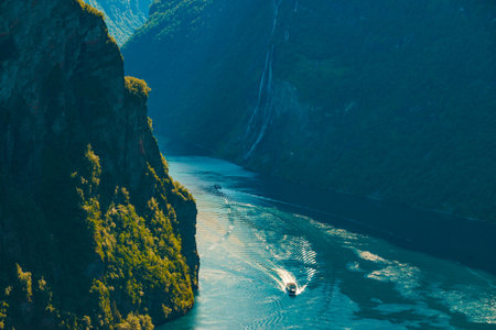 Fjord Geirangerfjord with ferry boat, view from Ornesvingen viewing point, Norway. travel destinationの写真素材