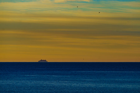 Cruise ship on sea water at sunrise. Morning seascape.の写真素材