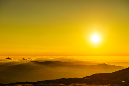 Burning sunset above the clouds. View from Torre mountain peak of Serra da Estrela in Portugal.の写真素材