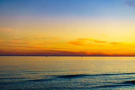 Colorful sky at sunset over sea surface.の写真素材