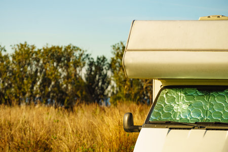 Camper with internal thermal screen blind at window pane. Camping on nature. Holidays and travel with motor home.の写真素材
