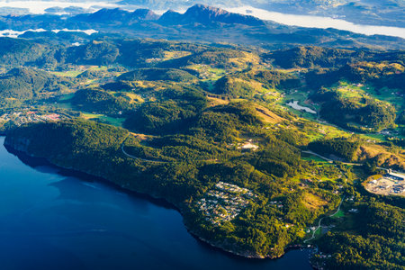 View from airplane to Norwegian fjords landscape. Aircraft flying over Norway Scandinavia.の写真素材
