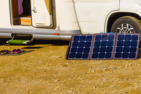 Portable solar photovoltaic panel, charging battery at caravan. Holidays with motor homeの写真素材