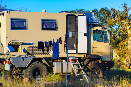 Off road camper 4x4, rv motor home on nature. Travel with motorhome truck.