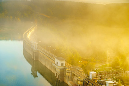 Morning fog over dam on Embalse de Aguilar de Campoo in province of Palencia, Castile and Leon...
