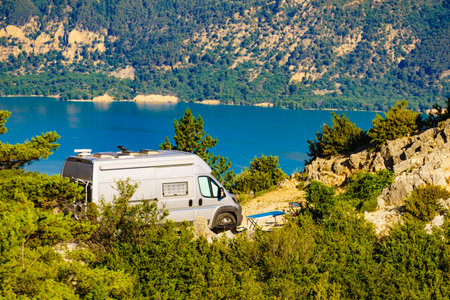 Campervan camping at Sainte Croix Lake, Verdon Gorge in french Alps mountains, Provence France. Holidays trip.の写真素材