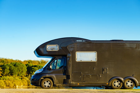 Camper vehicle camping on nature. Povoa e Meadas Dam in Castelo de Vide, Alentejo Portugal. Travel in motor home.の写真素材