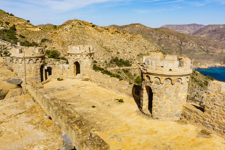 Tourist destination. Battery de Castillitos in Spain Cartagena, Cabo Tinoso. Fortifications facade imitating medieval castle. Defensive architecture.の写真素材
