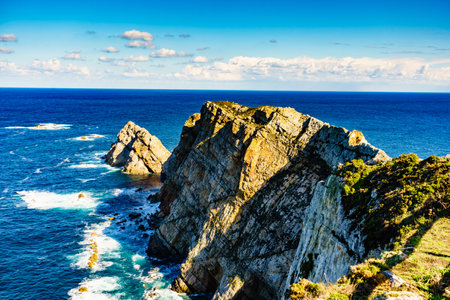 Seascape of Atlantic ocean and Asturias rocky coast at Cape Penas. Sea shore with high cliffs in north Spain.の写真素材