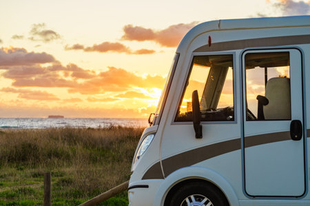 Caravan camping on beach at sunset. Mediterranean region of Costa del Sol, Andalusia Spain.の写真素材
