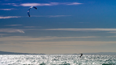 Kiteboarding. Kite surfer rides waves, Tarifa, Cadiz in Spain. Sports activities. Kitesurfing action.の写真素材