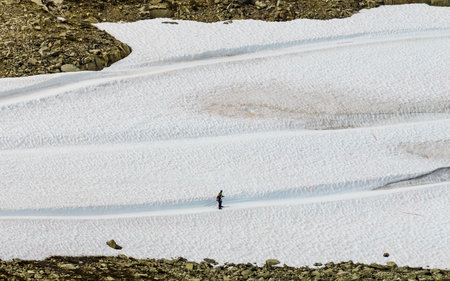 Sports activity. Cross country ski at road 55 Sognefjellet national tourist route between Lom and Luster, Norway. Two skiers training on track.の写真素材