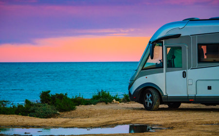 Caravan vehicle camping on mediterranean coast in Spain. Vacation in motor home.の写真素材