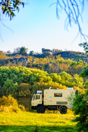 Off road camper 4x4, rv motor home on nature. Travel with motorhome truck.の写真素材