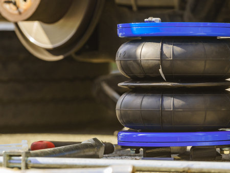 Installing auto air ride suspension. Car in service.の写真素材
