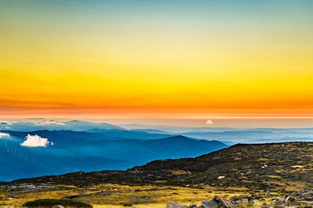 Burning sunset above the clouds. View from Torre mountain peak of Serra da Estrela in Portugal.の写真素材