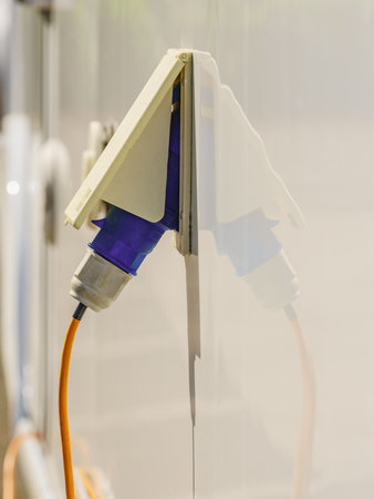 RV electrical cord plug power recharging travel trailer motorhome, electric connection from campsite.の写真素材