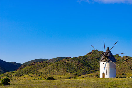 Old wind mill in Cabo de Gata Nijar National Park, Almeria in Spain.の写真素材