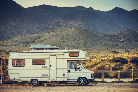 Caravan rv with cargo box on roof camping on mountain nature, Cabo de Gata Natural Park, provincia Almeria, Andalusia Spain.の写真素材