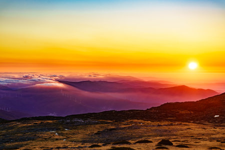 Burning sunset above the clouds. View from Torre mountain peak of Serra da Estrela in Portugal.の写真素材