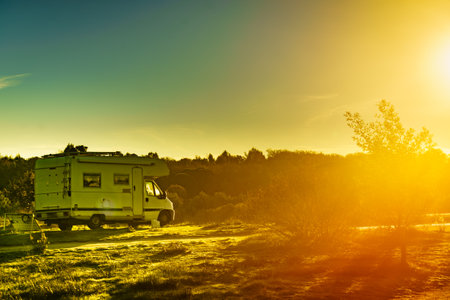 Camper vehicle camping on nature. Povoa e Meadas Dam in Castelo de Vide, Alentejo Portugal. Travel in motor home.の写真素材