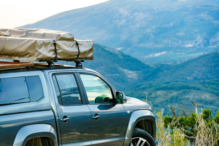 Off road 4x4 car equipped with camping gear and roof tent driving through mountain, Verdon Gorge in France.の写真素材