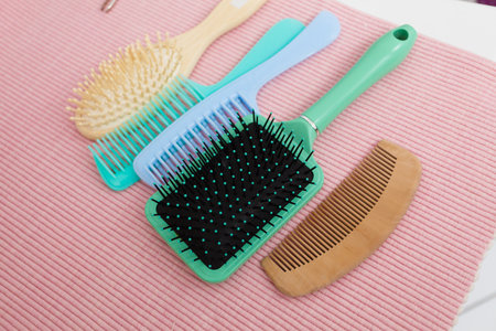 Hair comb and brush tools in bathroomの写真素材