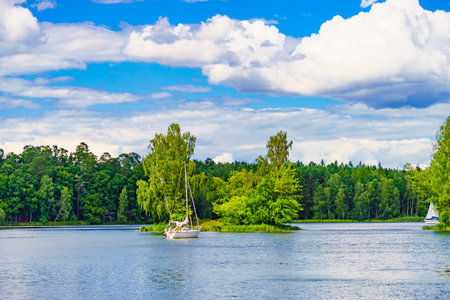 Boat yacht on lake during summer. Tuchola national park in Poland. Yachting, holidays concept.の写真素材