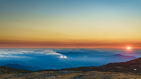 Burning sunset above the clouds. View from Torre mountain peak of Serra da Estrela in Portugal.の写真素材