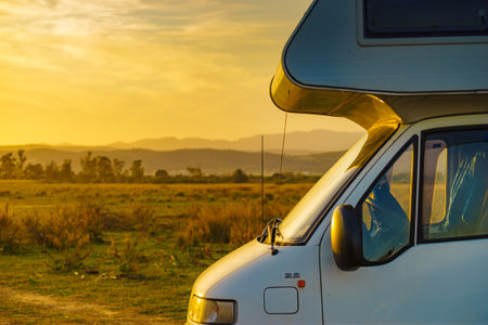 Camper recreational vehicle camping on nature. Caravan lifestyle. Holidays and travel in motorhome.の写真素材