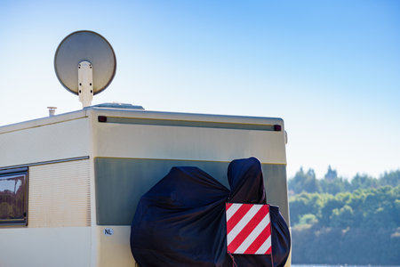 Satellite dish on roof of camper vehicle. TV connection. Travel holidays in motor home.の写真素材