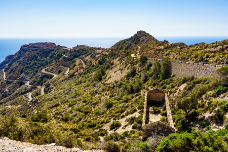 Tourist destinations in Spain. Fortification area Battery de Castillitos near Cartagena, Cabo Tinoso. View from distance with sea horizon.の写真素材