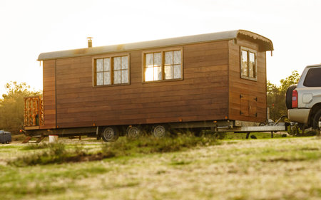 Caravan wooden construction trailer used as tiny house.