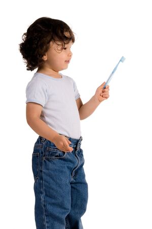 child with toothbrush on whiteの写真素材