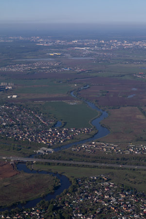 bird's eye view of the city forest and fieldsの写真素材